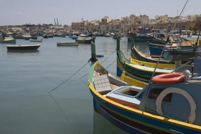 Framed Print : Brightly coloured fishing boats called Luzzus at the fishing village of Marsaxlokk Framed Print : Brightly coloured fishing boats called Luzzus at the fishing village of Marsaxlokk
