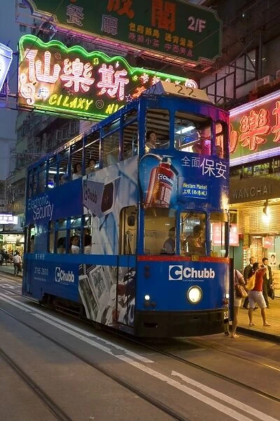 Brightly coloured trams running between Central and Wan Chai, Wan Chai