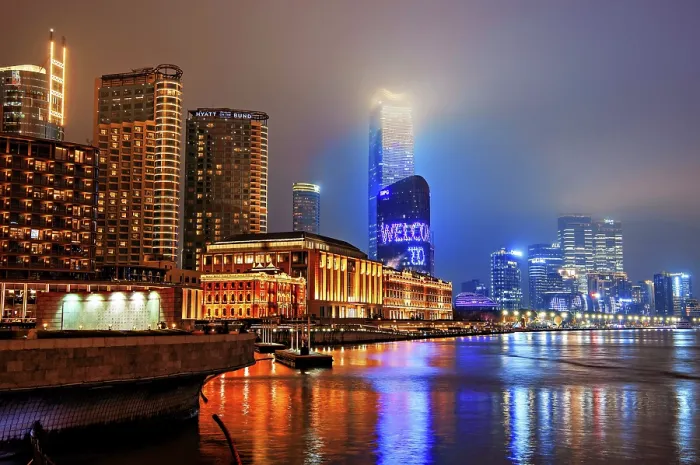 Framed Print : Brightly lit Shanghai city view at night shrouded in mist at the Bund, Shanghai, China. The low rise buildings are The Grand Halls which were previously warehouses built in 1902 Framed Print : Brightly lit Shanghai city view at night shrouded in mist at the Bund, Shanghai, China. The low rise buildings are The Grand Halls which were previously warehouses built in 1902