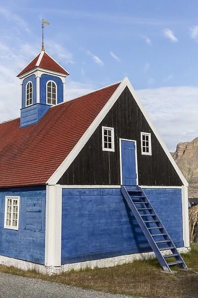 Brightly painted house with ladder to upstairs storage in Sisimiut, Greenland, Polar Regions