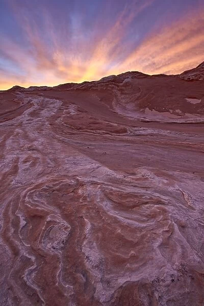 Brilliant orange clouds at sunset over red and white sandstone, White Pocket, Vermilion Cliffs National Monument, Arizona, United States of America, North America
