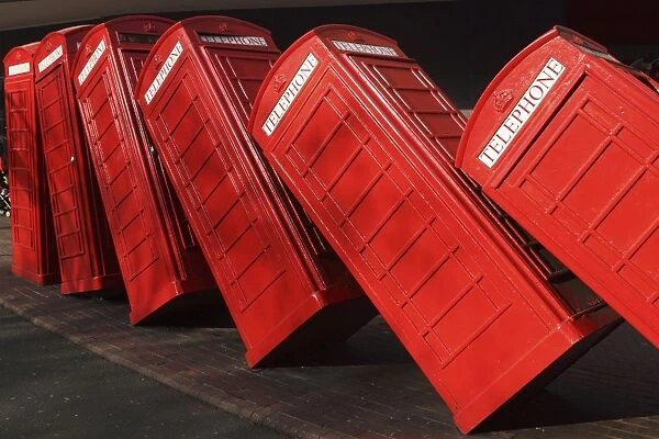 British red K2 telephone boxes, David Machs Out of Order sculpture, at Kingston-upon-Thames, a suburb of London, England, United Kingdom, Europe