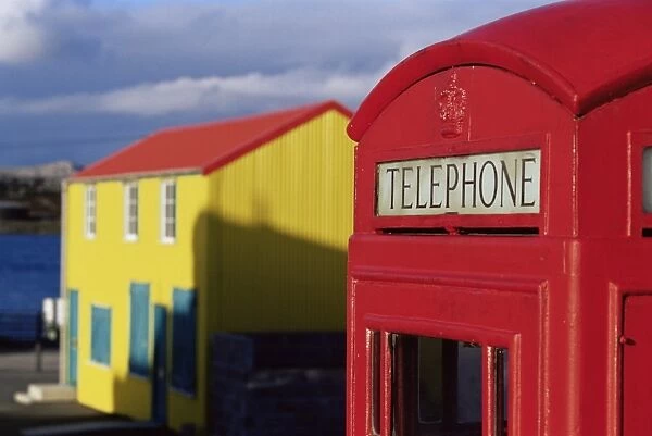 British red telephone box and colourful traditional house, Stanley, East Falkland