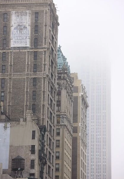 Broadway and Empire State Building shrouded in mist, Manhattan, New York City