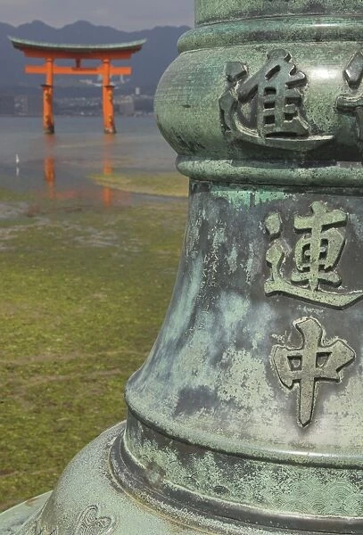 Bronze pole with Chinese characters in foreground