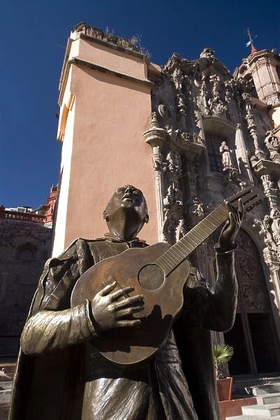 Bronze statue of a singing Mexican, in front of the Temple of San Diego