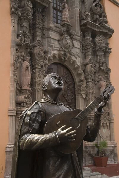 Bronze statue of a singing Mexican, in front of the Temple of San Diego