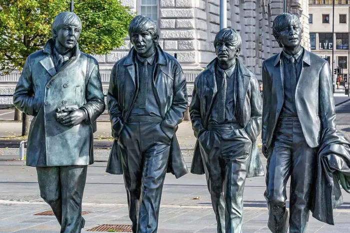 Framed Print : Bronze statues of the four members of a famous band, The Beatles, walking in line on a city street, with buildings in the background in Liverpool, Merseyside, England, United Kingdom, Europe Framed Print : Bronze statues of the four members of a famous band, The Beatles, walking in line on a city street, with buildings in the background in Liverpool, Merseyside, England, United Kingdom, Europe