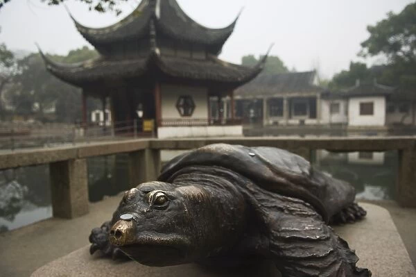 A bronze terrapin statue and pagoda at West Garden Buddhist Temple, Suzhou