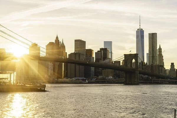 Brooklyn Bridge and Lower Manhattan skyline at sunset, New York City, New York, United States of America, North America