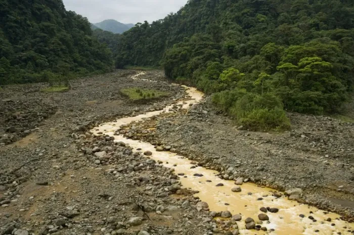 Framed Print : Brown water flowing from river fed with volcanic silt, Costa Rica Framed Print : Brown water flowing from river fed with volcanic silt, Costa Rica