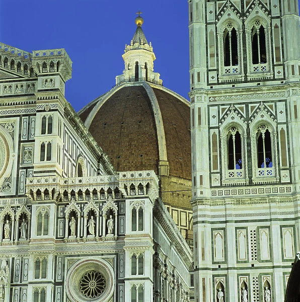 Brunelleschis dome and exterior of the Duomo floodlit at night