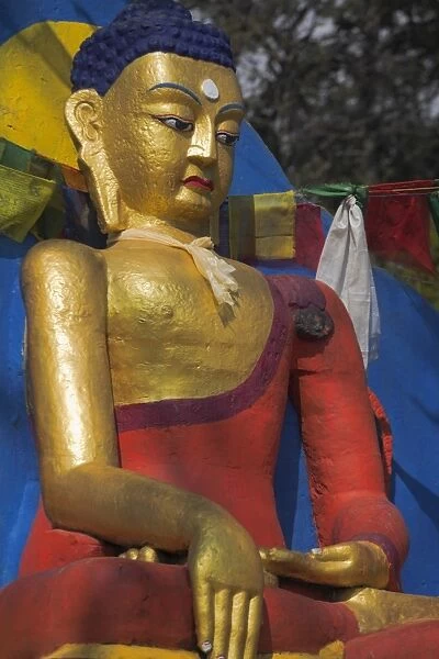 Buddha image at base of stupa