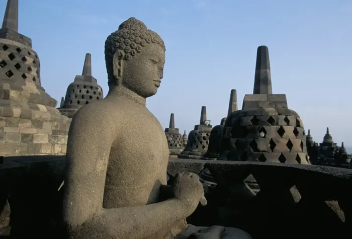 Framed Print : Buddha image sitting in open chamber with stupas in background Framed Print : Buddha image sitting in open chamber with stupas in background