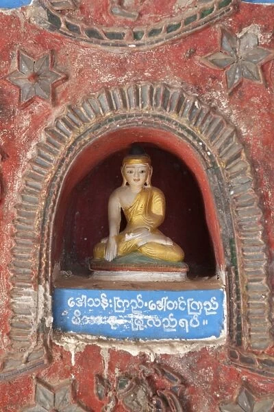 Buddha offerings in wall niche, Shwe Yan Pyay monastery, Nyaungshwe, Inle Lake, Shan State, Myanmar (Burma), Asia