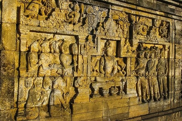 Buddha reliefs in the temple complex of Borobodur, UNESCO World Heritage Site, Java, Indonesia, Southeast Asia, Asia