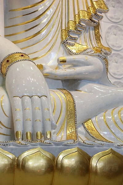 Detail of Buddha sitting in bhumisparsha-mudra posture (calling the earth to witness)