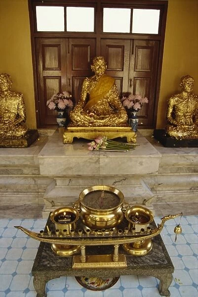 Buddha statues covered in gold leaf