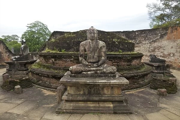 One of the Buddha statues on the upper platform, next to the stupa, Vatadage, Polonnaruwa, UNESCO World Heritage Site, Sri Lanka, Asia
