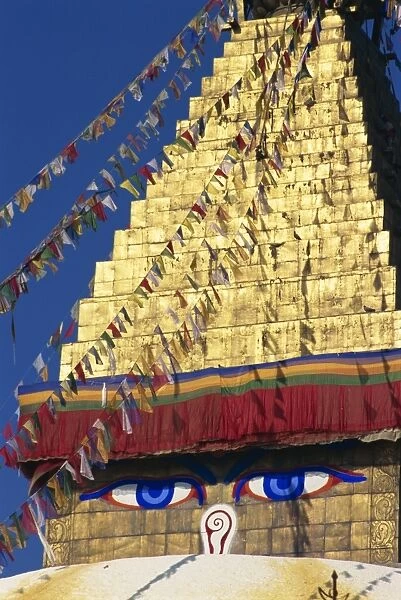 Buddhas eyes on gold leaf spire of one of the world s