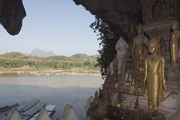Buddhas in Pak Ou caves, Mekong River near Luang Prabang, Laos, Indochina