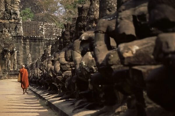 Buddhist monk approaching South Gate, Angkor Thom, Angkor, UNESCO World Heritage Site