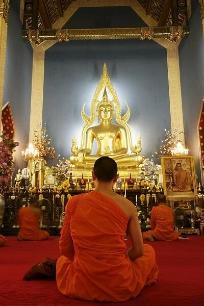 Buddhist monk praying