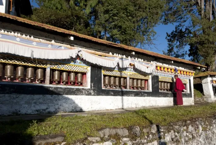 Framed Print : Buddhist monk in red robes turning prayer wheels in contemplative morning prayer, Tawang Buddhist monastery, Arunachal Pradesh, India, Asia Framed Print : Buddhist monk in red robes turning prayer wheels in contemplative morning prayer, Tawang Buddhist monastery, Arunachal Pradesh, India, Asia