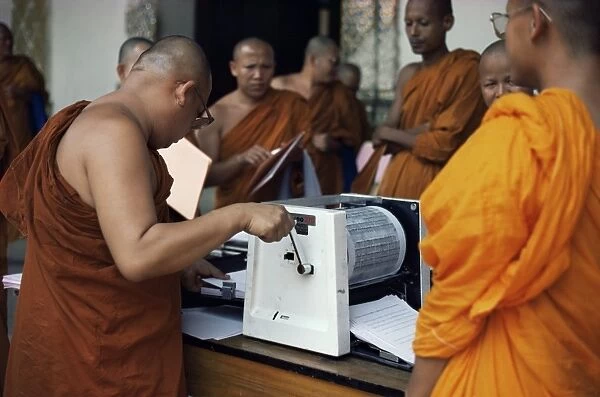 Buddhist monks using stencil machine