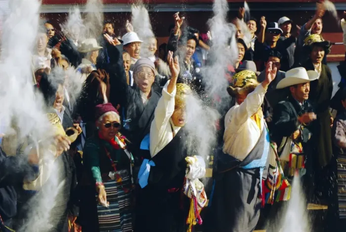 Framed Print : Buddhist people throwing flour into the air Framed Print : Buddhist people throwing flour into the air