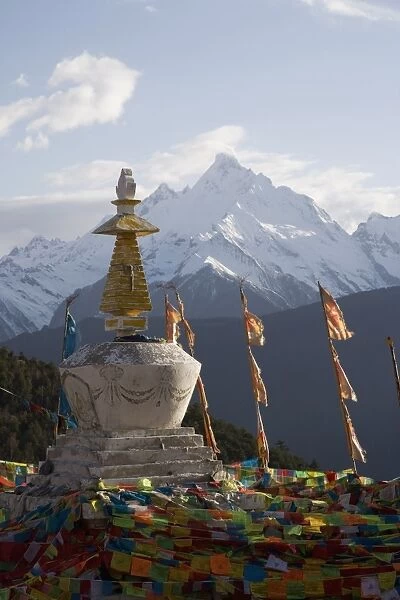 Buddhist stupa with Meili Snow Mountain peak in background, en route to the Tibetan border