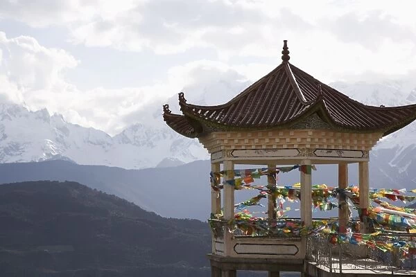 Buddhist stupa on way to Deqin, on the Tibetan Border, with the Meili Snow Mountain peak in the background, Dequin, Shangri-La region, Yunnan Province
