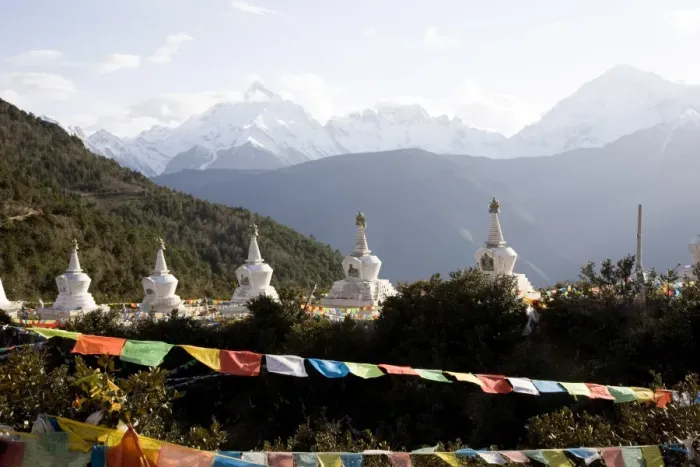 Framed Print : Buddhist stupas with Meili Snow Mountain peak in background, en route to the Tibetan border Framed Print : Buddhist stupas with Meili Snow Mountain peak in background, en route to the Tibetan border