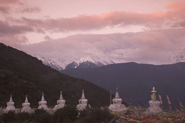 Buddhist stupas on way to Deqin, on the Tibetan Border, with the Meili Snow Mountain peak in the background, Dequin, Shangri-La region, Yunnan Province