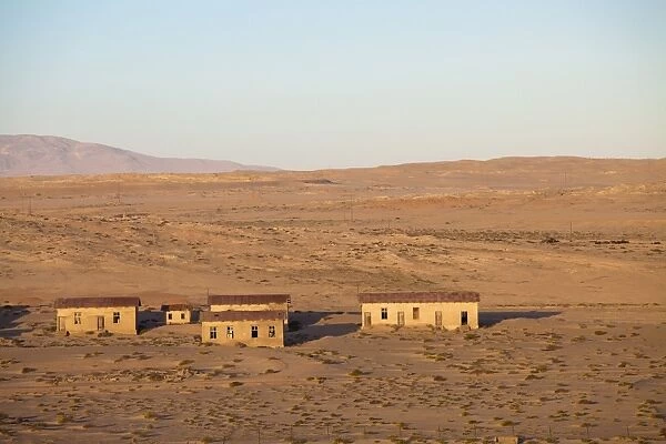Buildings in the abandoned former German diamond mining town of Kolmanskop on the edge of the Namib Desert, Forbidden Diamond Area near Luderitz, Namibia