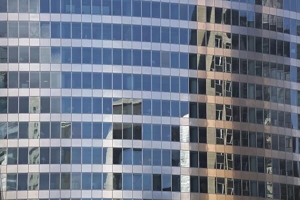 Buildings reflecting in a building in the La Defense district, Paris, France, Europe