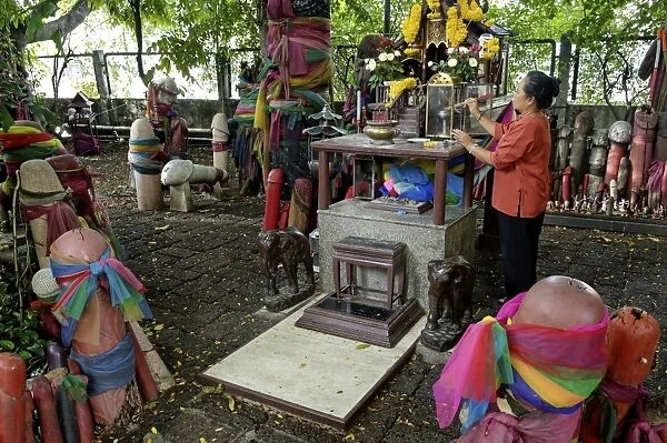 Formerly built to re-house the spirit from the ficus tree, donations of phallic symbols have resulted in the shrine being dedicated to fertility, Chao Mae Tuptim (Shrine of the Goddess Tuptim), Bangkok, Thailand, Southeast