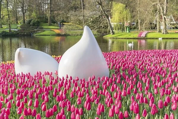 Bulblike sculpture and pink tulips at Keukenhof Gardens, Lisse, South Holland province