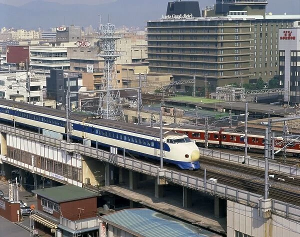 The bullet train passing the Grand Hotel in Kyoto
