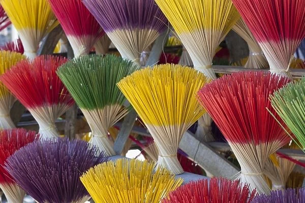 Bundles of incense sticks for sale, made by traditional craftsmen from Thuy Zuan Hat village along the road to the Tu Duc Royal Tomb, Hue, Vietnam, Indochina, Southeast Asia, Asia