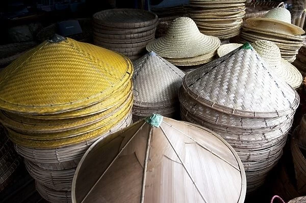 Burmese hats hand made from bamboo leaves and grasses, for sale in roadside market on Mandalay Road