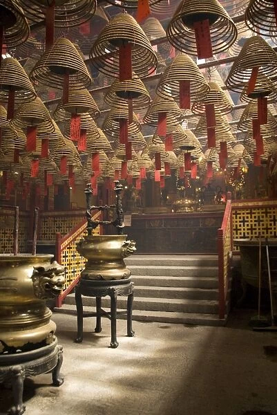 Burnign incense cones hung from the ceiling, Man Mo Temple, Sheung Wan