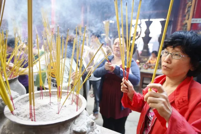 Framed Print : Burning incense during Tet, the Vietnamese lunar New Year celebration, Thien Hau Temple Framed Print : Burning incense during Tet, the Vietnamese lunar New Year celebration, Thien Hau Temple