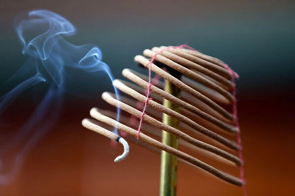 Burning spiral incense sticks in Taoist ceremony, Mau Son Taoist temple, Sapa, Vietnam