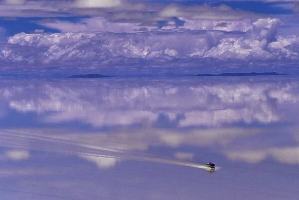 Bus driving through the ethereal landscape of the Salar de Uyuni, Salar de Uyuni salt lake