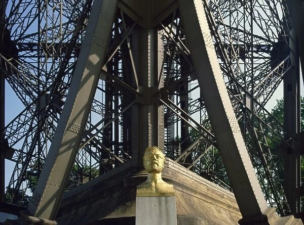 Bust of Gustav Eiffel under his famous landmark, the Eiffel Tower, Paris, France, Europe