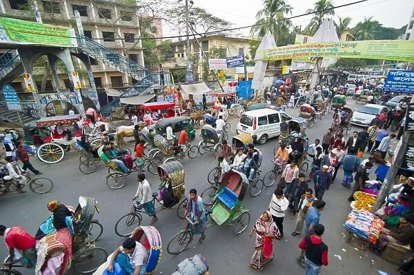 Busy rickshaw traffic on a street crossing in Dhaka, Bangladesh, Asia