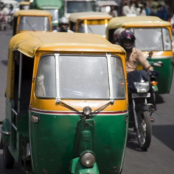 Busy road with Tuk-tuk auto rickshaws, Chandni Chowk, Old Delhi, India, Asia