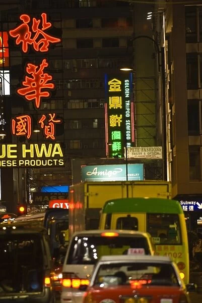 Busy street in Kowloon at night, Hong Kong, China, Asia