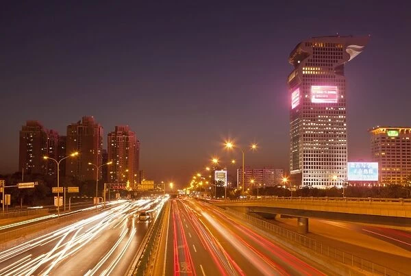 Busy traffic and light trails through city centre, Beijing, China, Asia